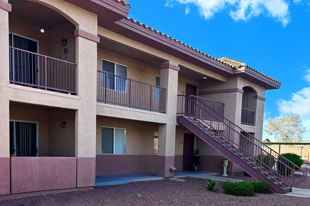 This image displays exterior photo of Colores Del Sol Apartments