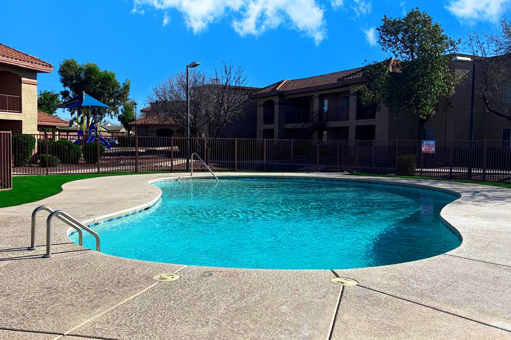 This image displays swimming pool photo of Colores Del Sol Apartments