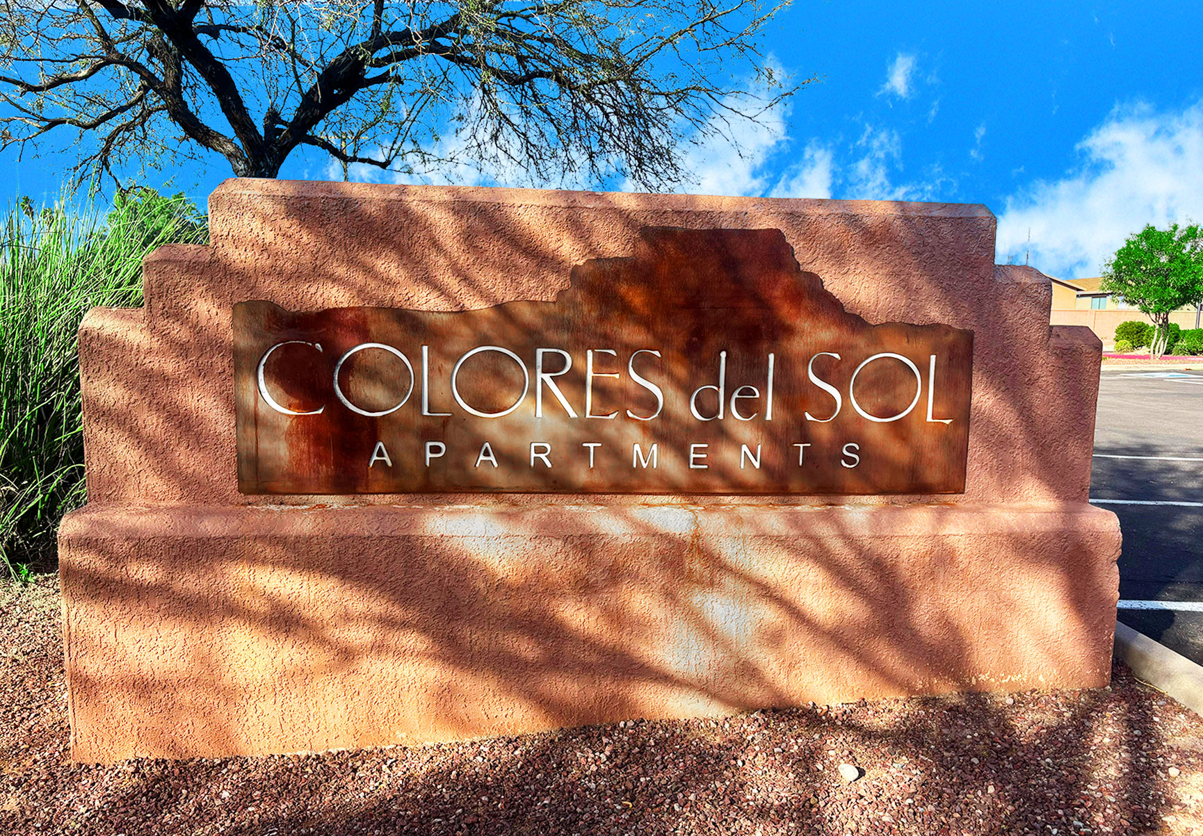 This image displays entrance marker photo of Colores Del Sol Apartments
